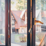 Open window close up. House in background